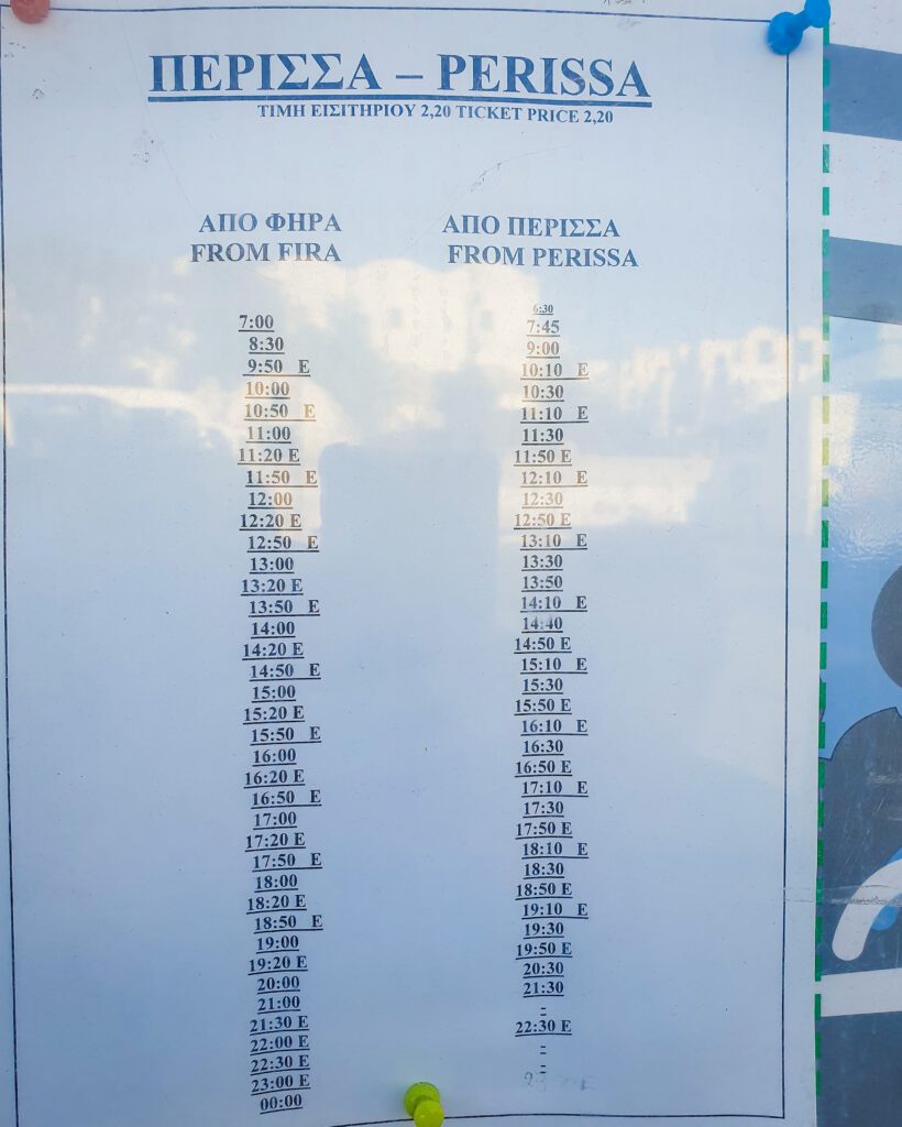 A sign of the bus timetable for the bus from Fira to Perissa in Santorini, Greece "A Complete Guide To The Santorini Public Transport System"