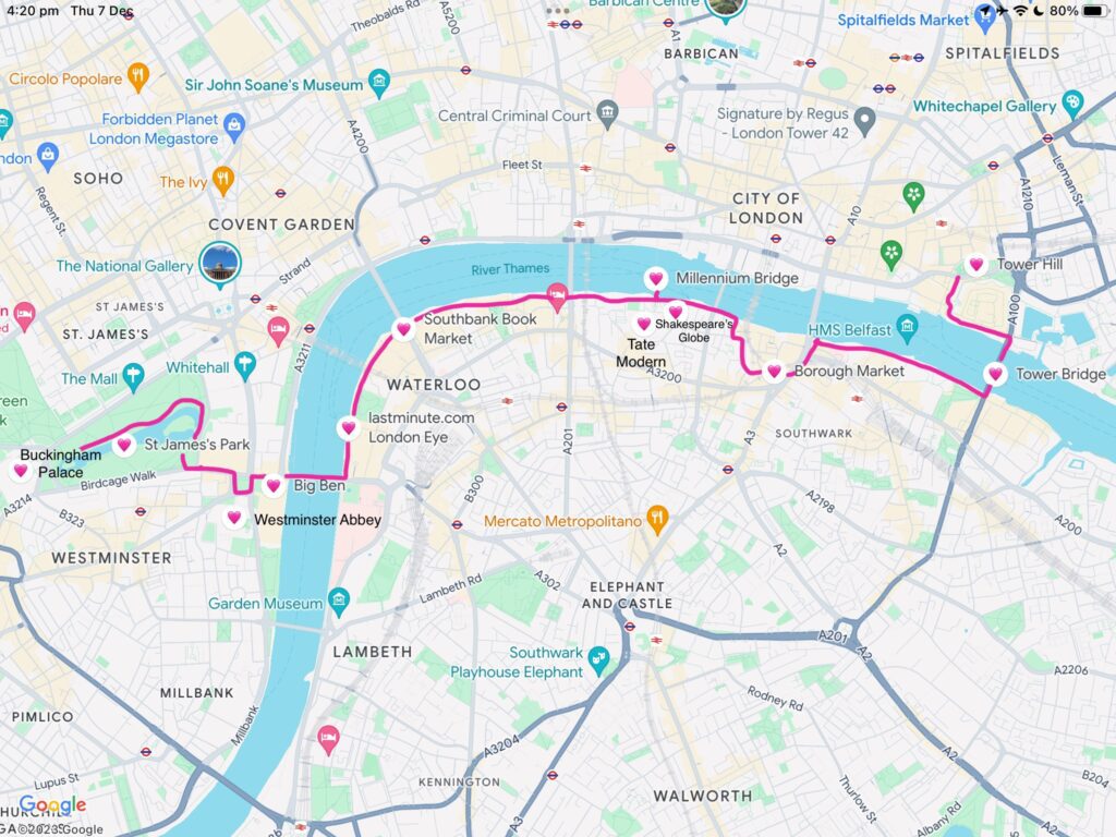 A Google Maps screenshot of Southbank in London, England with a pink line running from Tower Hill, across the water to Borough Market, past Shakespeare's Globe and Millennium Bridge, down to the London Eye, across the water to Big Ben, St James Park and ending at Buckingham Palace "How to Have the Best Time in London (For Free!)"